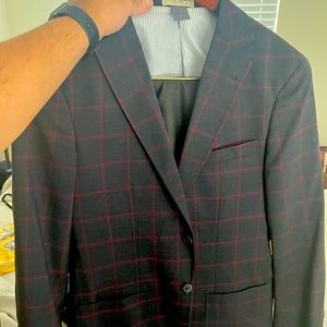 Dark gray sportscoat, with red window pane.